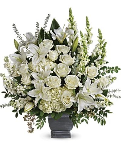 <div class="m-pdp-tabs-description">
<div id="mark-1" class="m-pdp-tabs-marketing-description">Like the sun on the horizon, this pure white bouquet of hydrangea, roses and lilies offers hope and inspiration.</div>
</div>
<p id="arrngDescp">White hydrangea, white roses, white oriental lilies, white snapdragons, and white stock are arranged with huckleberry, seeded eucalyptus, spiral eucalyptus, green ti leaves, and lemon leaf.</p>