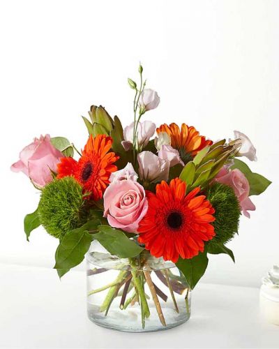 <p>Home is where the heart is, especially when you fill it with these roses and gerbera daisies.</p>