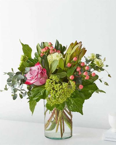 <p>Bring the great outdoors, in hydrangeas, roses, eucalyptus, and hypericum berries.</p>