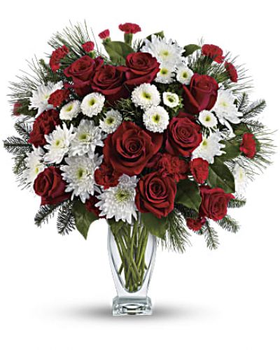 No mistletoe required! Simply send this romantic bouquet of snow whites and rich reds arranged in our sculpted glass vase, and you’re guaranteed a spot on her “nice” list.

This heartwarming bouquet includes red roses, red carnations, red miniature carnations, white matsumoto asters, white cushion chrysanthemums, noble fir, white pine and lemon leaf.