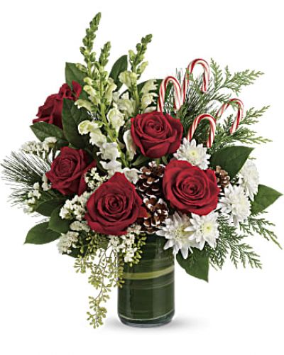 An instant Christmas party, this festive bouquet bursts with fresh blooms, winter greens and fun-filled candy canes.