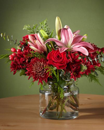 Make your loved ones blush with this Rosy Cheeks Bouquet, outfitted with stunning red roses and lilies. Cute enough to pinch, this gift will bring a flirtatious pop of color to a traditional holiday palette and kick the Christmas gathering off right.